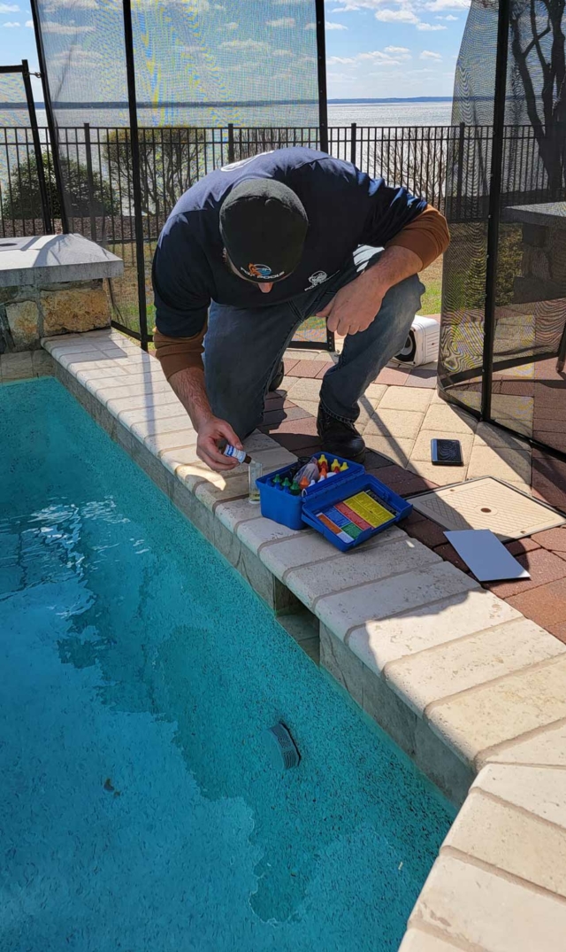 pool inspector checking equipment